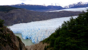 The Patagonia glacier pours out blue icebergs into the lake.