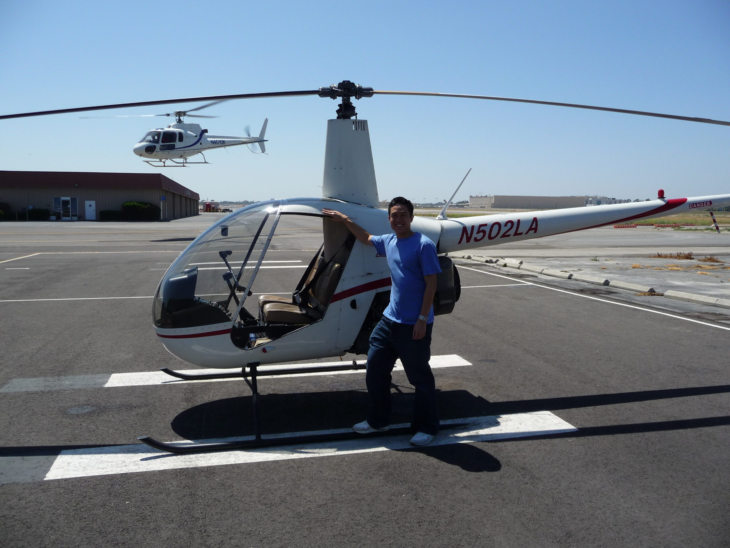 Standing next to the helicopter