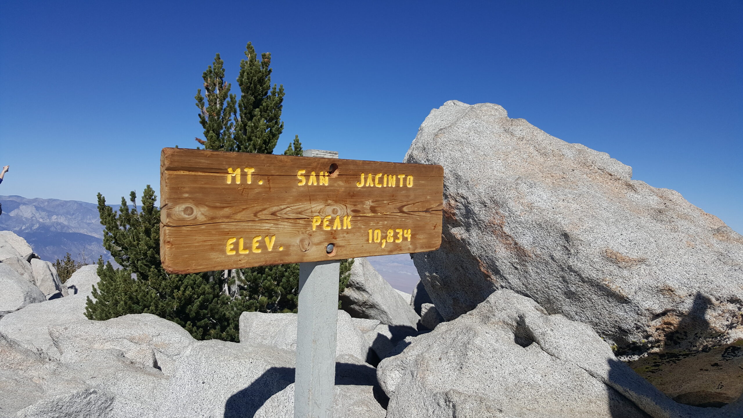 Pose by the San Jacinto Peak Sign