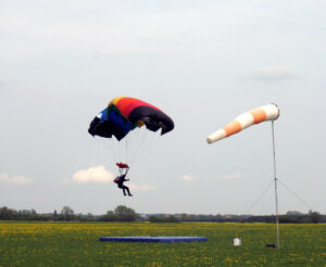 Skydiving: Skydive: Bend your knees while landing