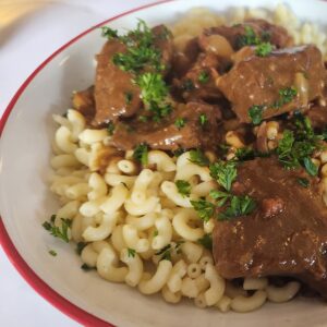 Paris - beef bourguignon on a bed of squiggly pasta