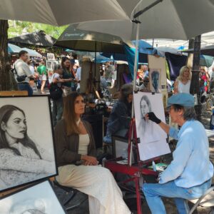 Paris - painter painting a woman's portrait at Montmartre