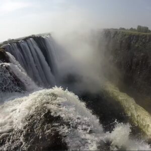 At Devil's Pool, you can stand at the edge of Victoria Falls as it rushes down the Zambezi River below