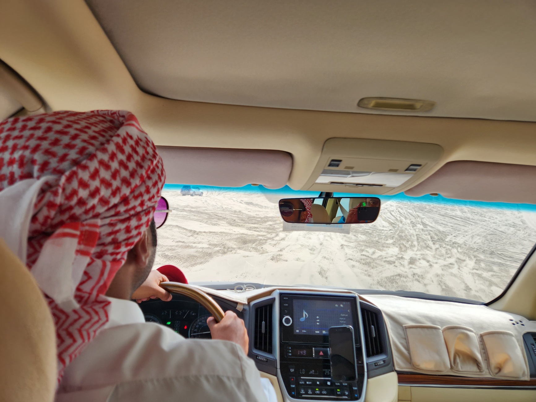 A driver is dune bashing in Qatar