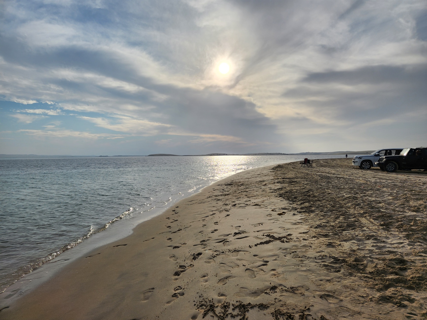The Inland Sea and a sandy beach below a setting sun