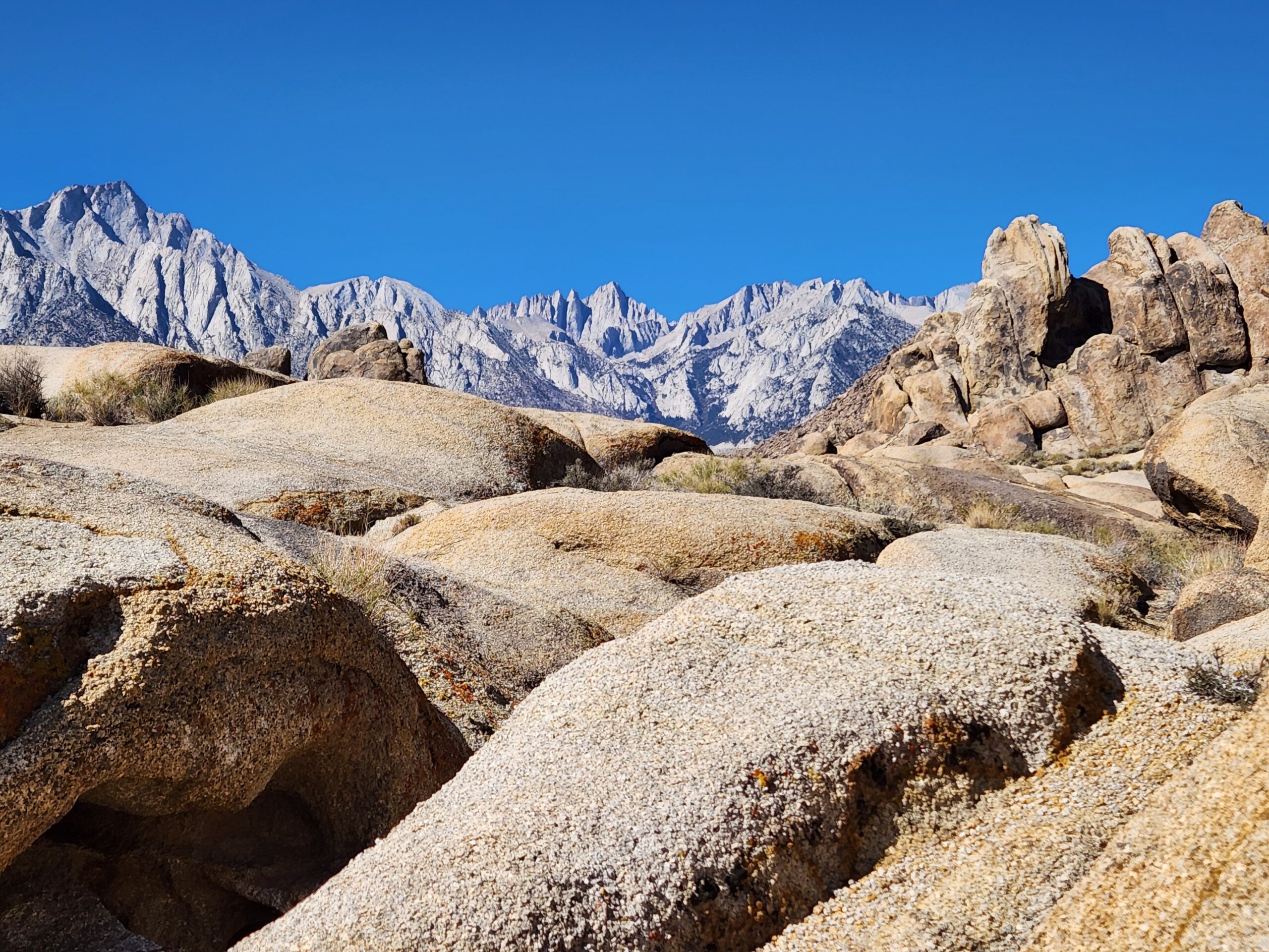 From the bare rock slabs of the Alabama Hills, you can see the top of Mt. Whitney