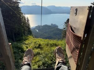 A pair of shoes hang past the launch gate while waiting to begin ziplining
