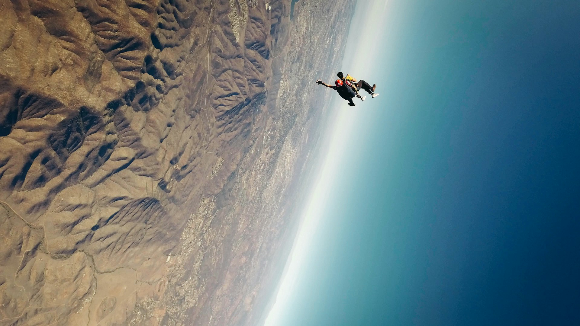 Skydiving in a vertical nosedive before the parachute opens