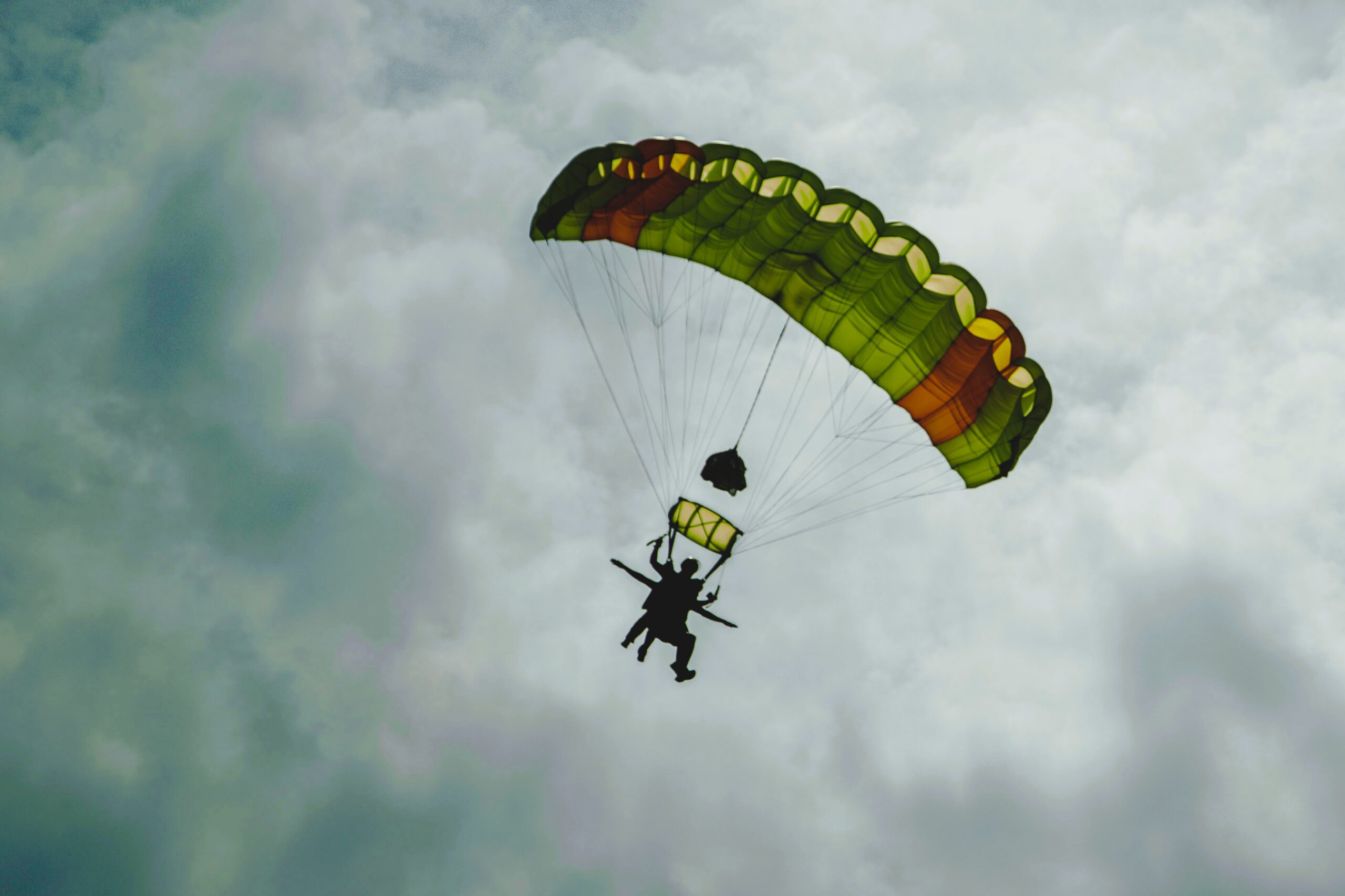 During skydiving, the parachute has deployed and the diver has taken control