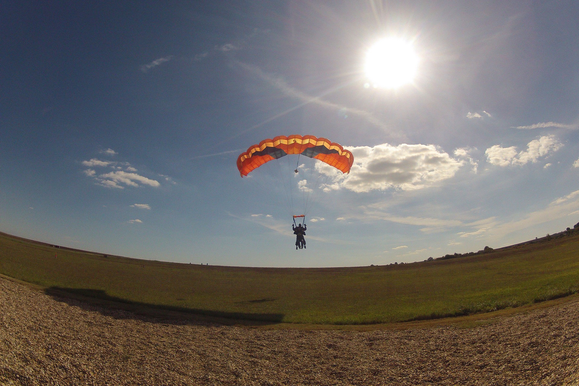 About to land on the ground after skydiving